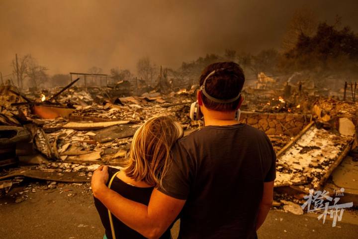 Megan Mantia, left, and her boyfriend Thomas, return to Mantia's fire-damaged home after the Eaton Fire swept through in Altadena, California, on January 8.