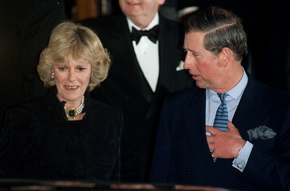 Britain's Prince Charles and Camilla Parker Bowles leave the Ritz Hotel in London, the first time that the couple, who have been friends for more than 25 years, have appeared together in public, Thursday, Jan. 28, 1999. (AP Photo/Alastair Grant, File)
